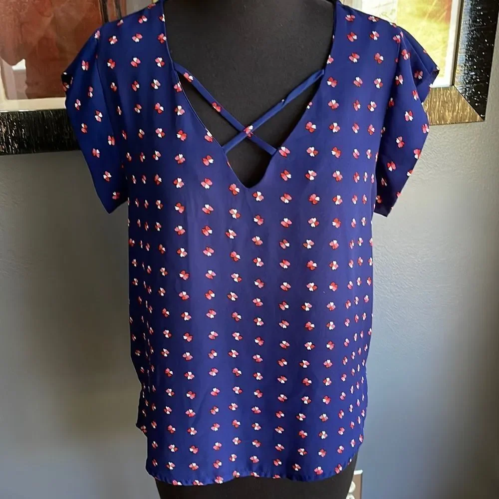 Lily White navy tiny heart flowers pattern X neckline top. Medium.
